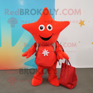 Red Starfish mascot costume character dressed with a Jacket and Tote bags