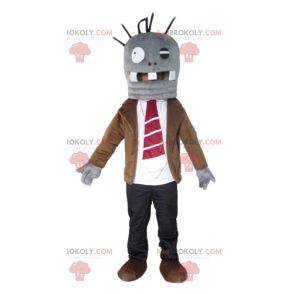 Mascota monstruo gris muy divertida en traje y corbata -