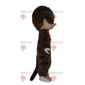 Mascota de Kiki el famoso mono marrón con un babero rojo -