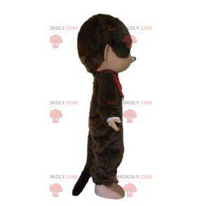 Mascotte de Kiki le célèbre singe marron avec un bavoir rouge -