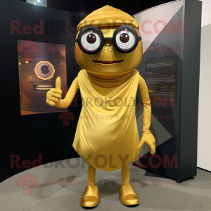 Gold Cyclops mascot costume character dressed with a Wrap Skirt and Eyeglasses