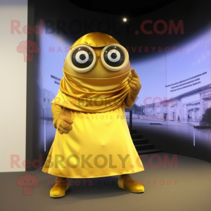 Gold Cyclops mascot costume character dressed with a Wrap Skirt and Eyeglasses