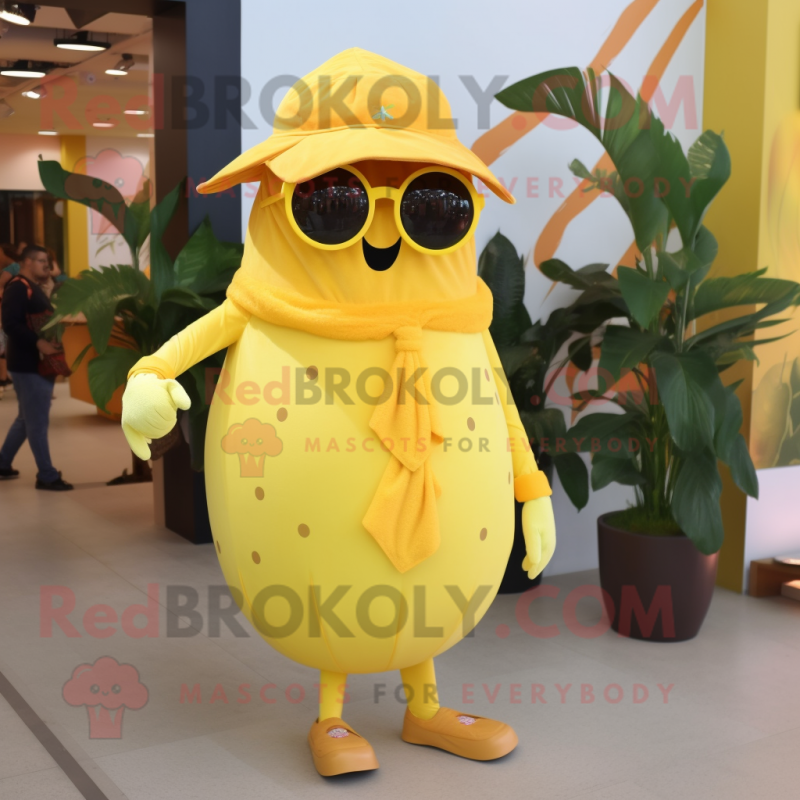 Yellow Raspberry mascot costume character dressed with a Cover-up and Sunglasses Yellow Raspberry mascot costume character dressed with a Cover-up and Sunglasses