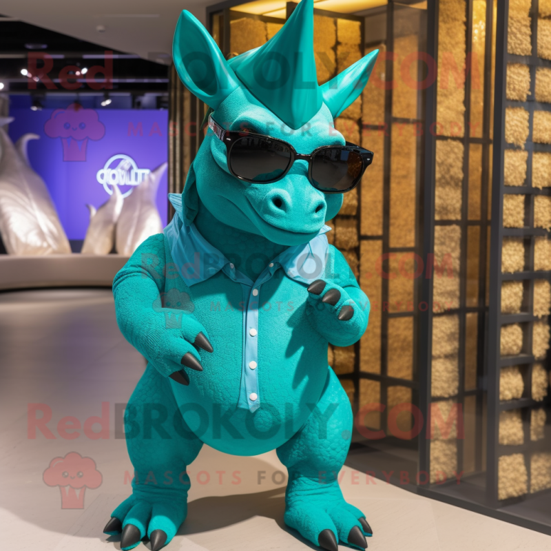 Turquoise Triceratops mascot costume character dressed with a Polo Shirt and Sunglasses