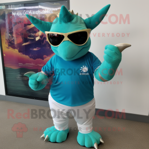 Turquoise Triceratops mascot costume character dressed with a Polo Shirt and Sunglasses