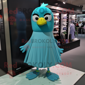 Cyan Blackbird mascot costume character dressed with a Evening Gown and Shoe laces