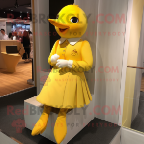 Yellow Dove mascot costume character dressed with a Mini Dress and Cufflinks