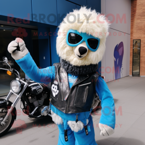 Blue Alpaca mascot costume character dressed with a Moto Jacket and Clutch bags