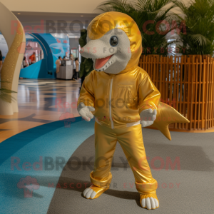 Gold Dolphin mascot costume character dressed with a Bermuda Shorts and Wraps