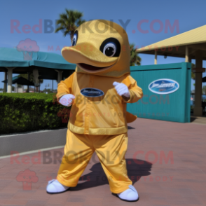 Gold Dolphin mascot costume character dressed with a Bermuda Shorts and Wraps