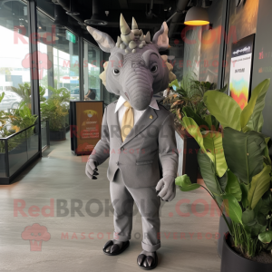Gray Triceratops mascot costume character dressed with a Suit Pants and Keychains