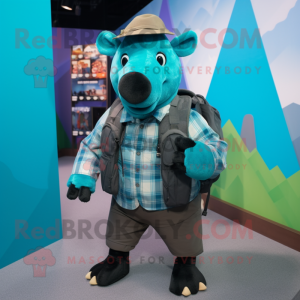 Teal Tapir mascot costume character dressed with a Flannel Shirt and Backpacks