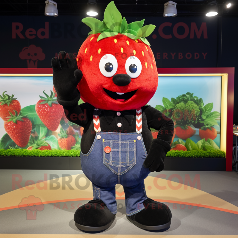 Black Strawberry mascot costume character dressed with a Jeans and Suspenders Black Strawberry mascot costume character dressed with a Jeans and Suspenders