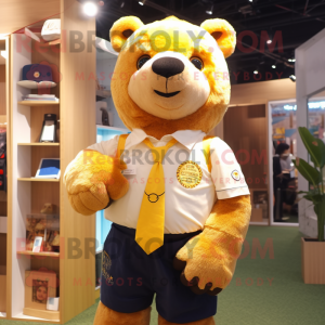 Gold Bear mascot costume character dressed with a Oxford Shirt and Keychains