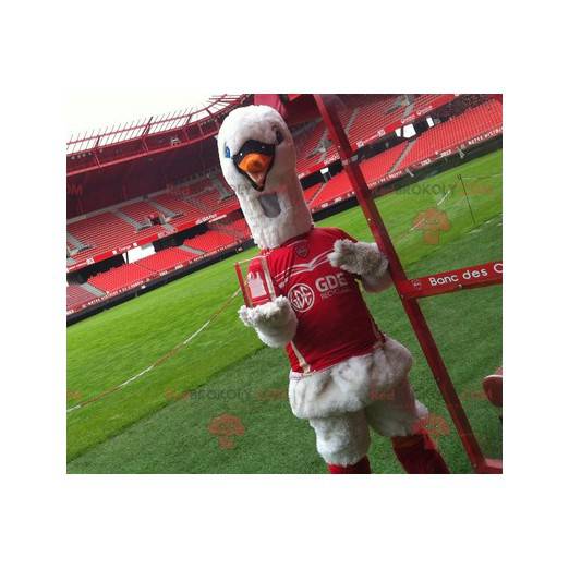 Mascote cisne em roupas esportivas vermelhas - Redbrokoly.com