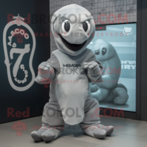 Gray Hydra mascot costume character dressed with a Cover-up and Beanies