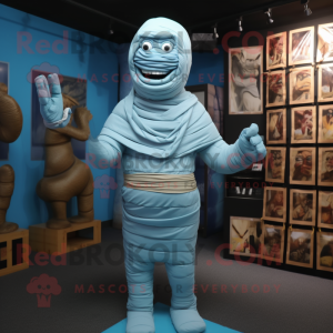 Sky Blue Mummy mascot costume character dressed with a Suit and Belts