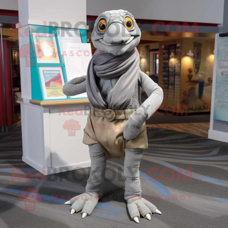 Silver Turtle mascot costume character dressed with a Dress Pants and Scarves