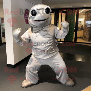 Silver Turtle mascot costume character dressed with a Dress Pants and Scarves