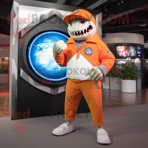 Orange Megalodon mascot costume character dressed with a Long Sleeve Tee and Digital watches