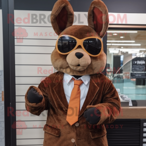 Brown Rabbit mascot costume character dressed with a Suit and Sunglasses