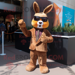 Brown Rabbit mascot costume character dressed with a Suit and Sunglasses