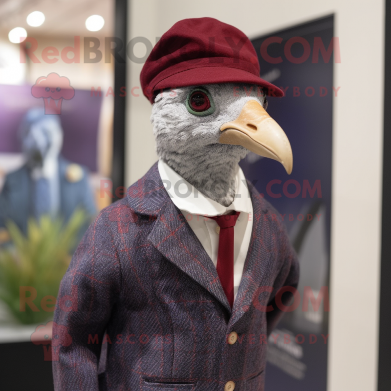 Maroon Guinea Fowl mascot costume character dressed with a Oxford Shirt and Berets