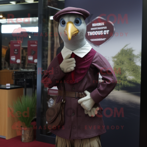 Maroon Guinea Fowl mascot costume character dressed with a Oxford Shirt and Berets