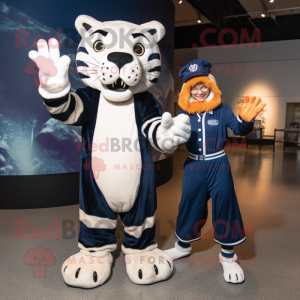 Navy Saber-Toothed Tiger mascot costume character dressed with a Shift Dress and Mittens