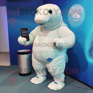 White Stellar'S Sea Cow mascot costume character dressed with a Bermuda Shorts and Smartwatches