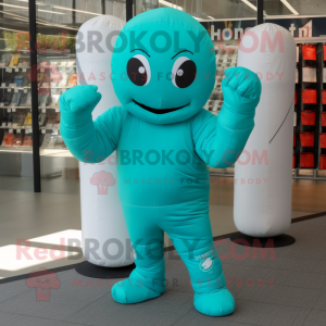 Turquoise Boxing Glove mascot costume character dressed with a Jumpsuit and Clutch bags