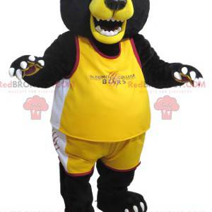 Velký maskot černého a žlutého medvěda ve sportovním oblečení
