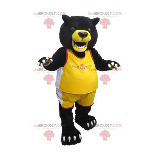 Mascote grande urso preto e amarelo em roupas esportivas -