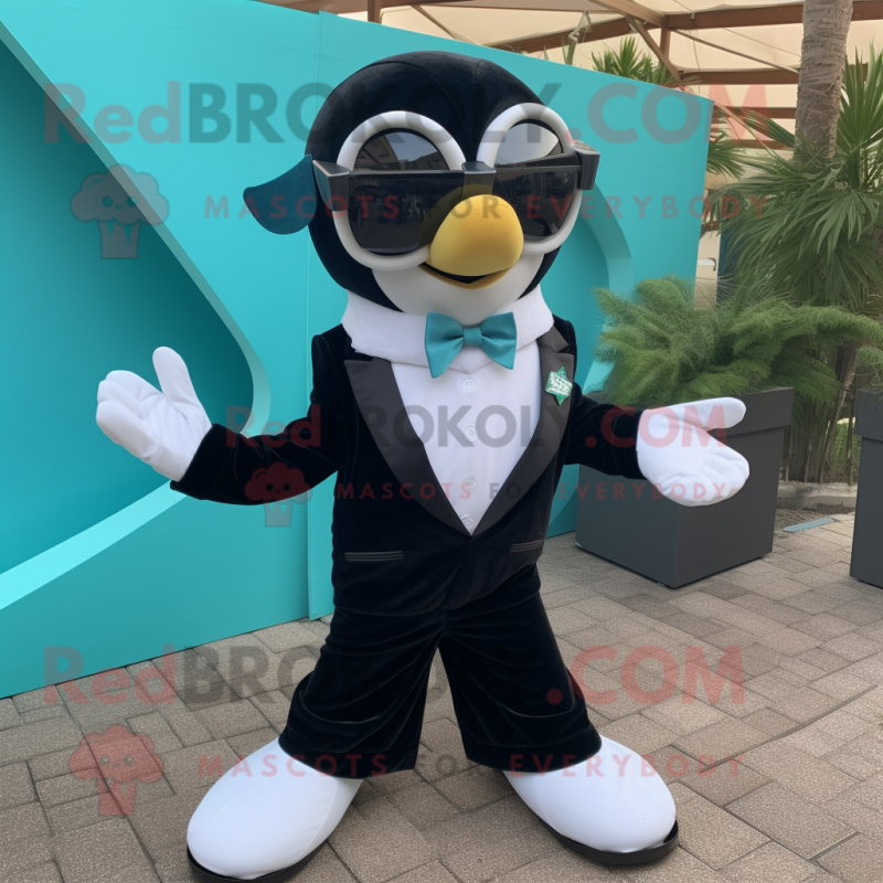 Teal Heart mascot costume character dressed with a Tuxedo and Sunglasses Teal Heart mascot costume character dressed with a Tuxedo and Sunglasses