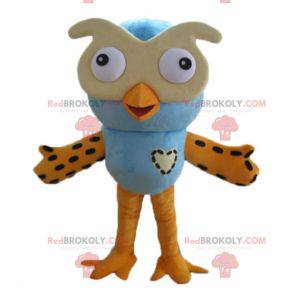 Mascote grande coruja azul e laranja com óculos - Redbrokoly.com