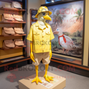 Lemon Yellow Passenger Pigeon mascot costume character dressed with a Cargo Shorts and Hat pins