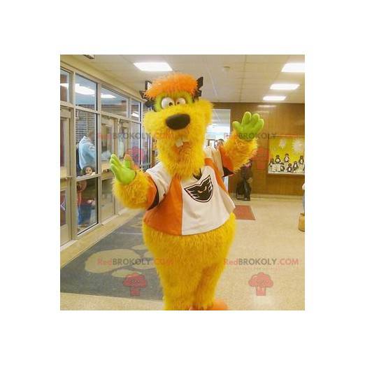 Yellow and orange monster mascot funny and hairy -