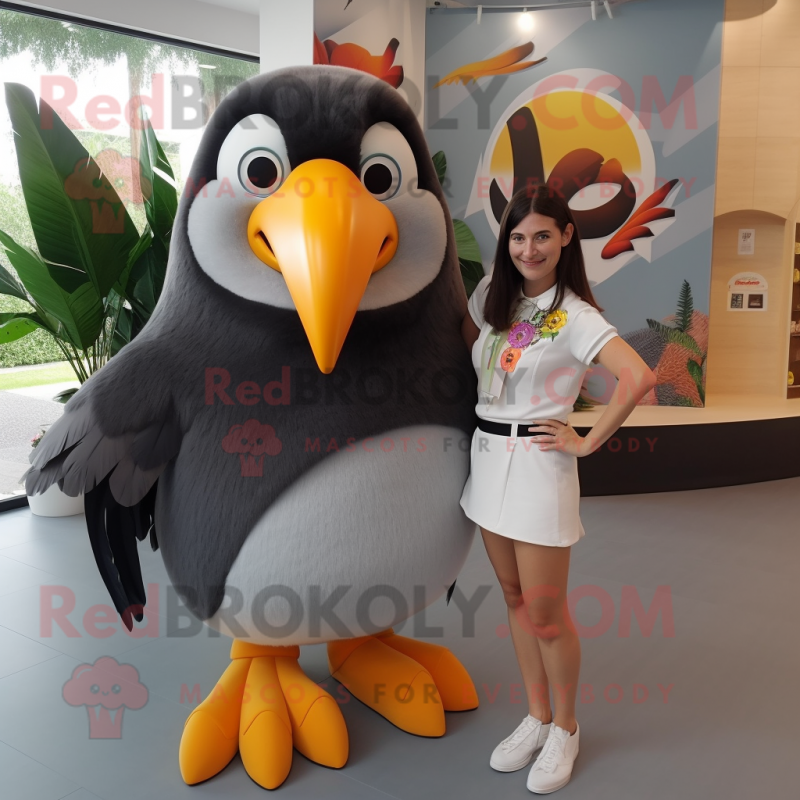 Gray Toucan mascot costume character dressed with a Mini Skirt and Hair clips Gray Toucan mascot costume character dressed with a Mini Skirt and Hair clips