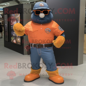 Orange Navy Seal mascot costume character dressed with a Denim Shorts and Cufflinks