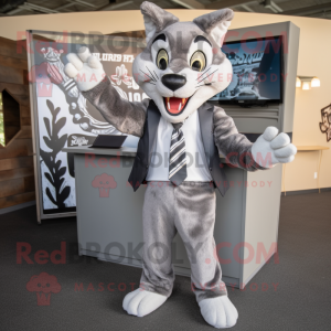 Gray Bobcat mascot costume character dressed with a Blazer and Headbands