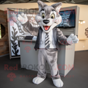 Gray Bobcat mascot costume character dressed with a Blazer and Headbands