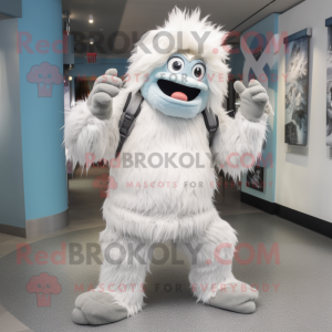 Silver Yeti mascot costume character dressed with a Chinos and Beanies