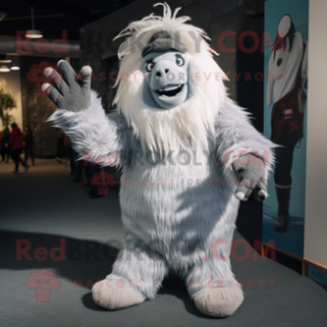 Silver Yeti mascot costume character dressed with a Chinos and Beanies