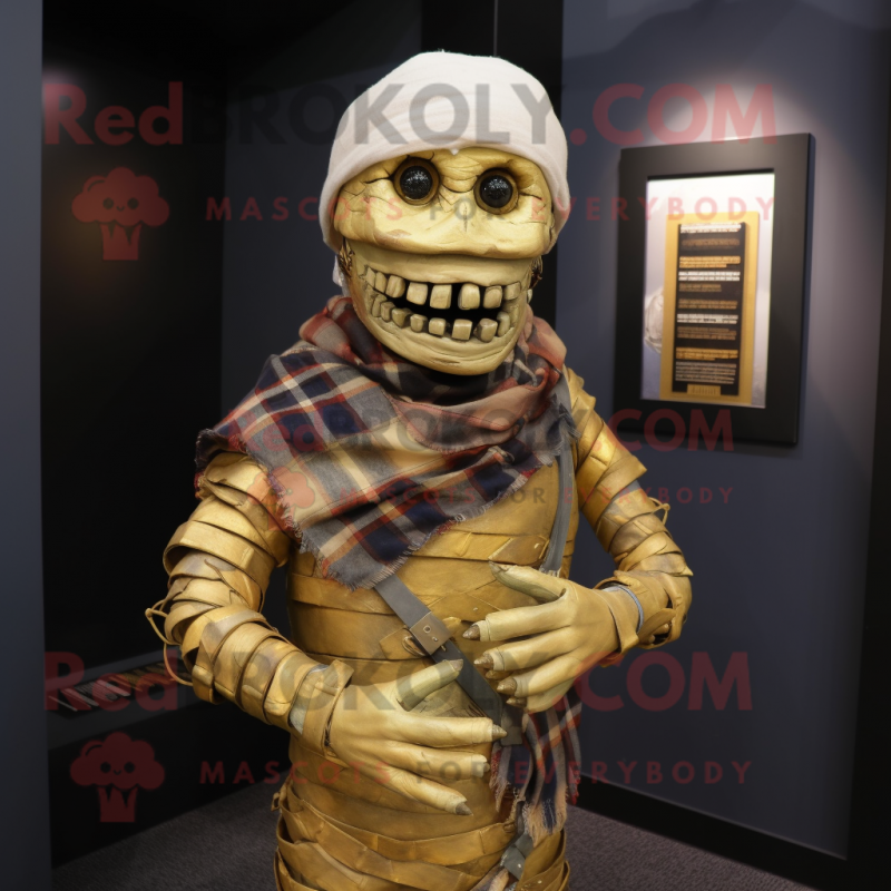 Gold Mummy mascot costume character dressed with a Flannel Shirt and Bracelets