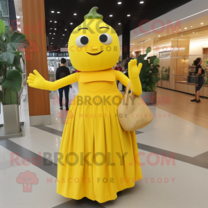 Yellow Zucchini mascot costume character dressed with a Empire Waist Dress and Tote bags