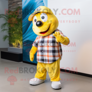 Lemon Yellow Clown Fish mascot costume character dressed with a Flannel Shirt and Caps