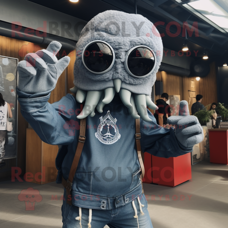 Silver Kraken mascot costume character dressed with a Denim Shorts and Mittens