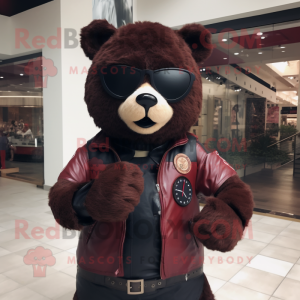 Maroon Spectacled Bear mascot costume character dressed with a Leather Jacket and Smartwatches