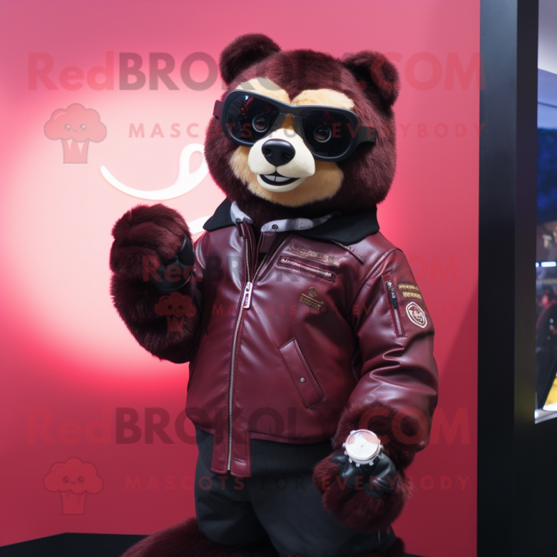 Maroon Spectacled Bear mascot costume character dressed with a Leather Jacket and Smartwatches