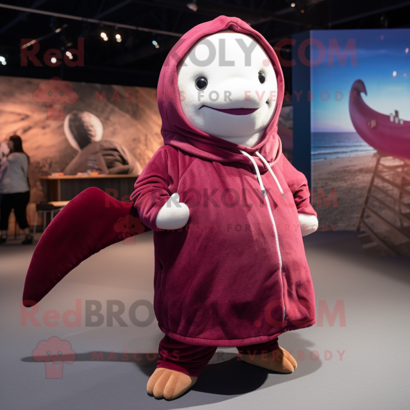 Maroon Narwhal mascot costume character dressed with a Hoodie and Berets